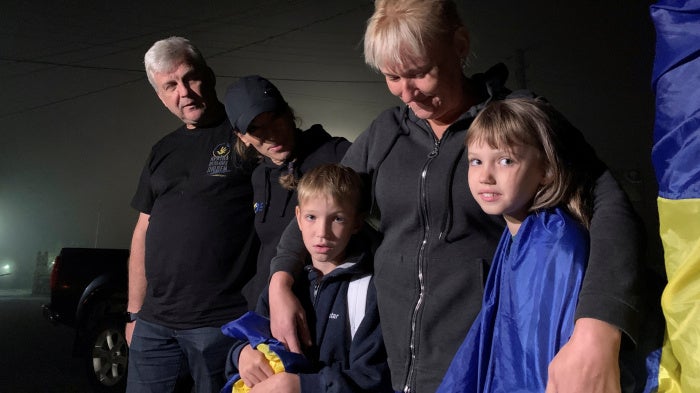 A mother hugs her children after their return from the occupied territory of Ukraine via the Ukraine-Belarus border, amid Russia's attack on Ukraine, in Volyn region, Ukraine, on September 3, 2023.