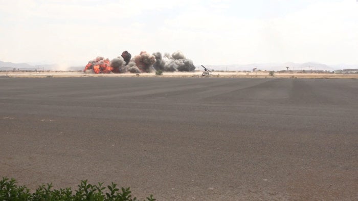 Smoke rises following an airstrike by Yemeni government forces in coalition with Saudi Arabia on Sanaa International Airport, Sanaa, Yemen, July 13, 2026. 