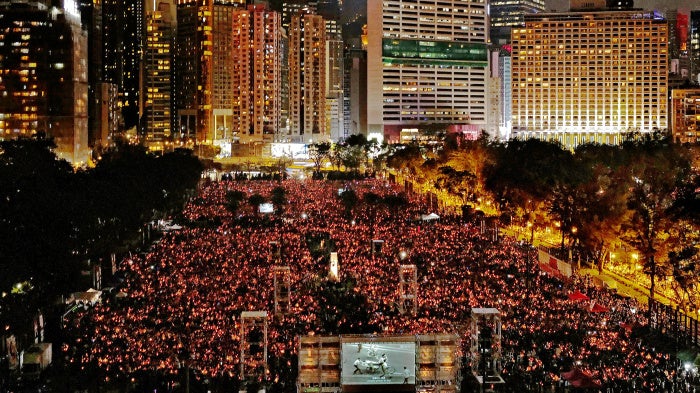 People attending a candlelight vigil