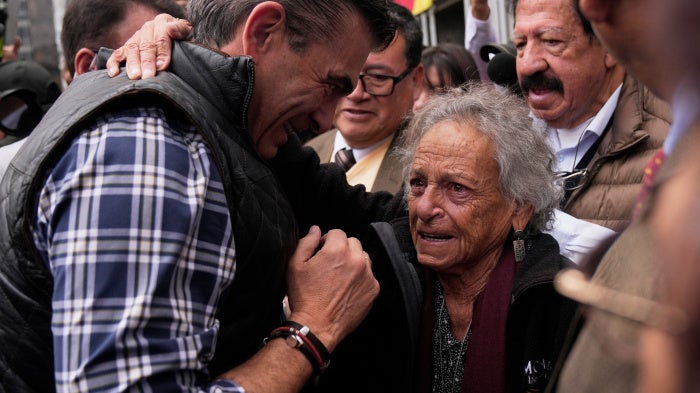 Bolivian President Rodrigo Paz (left), meets with activist Amparo Carvajal before entering the offices of the Permanent Assembly of Human Rights of Bolivia (APDHB), in La Paz, Bolivia, November 20, 2025.