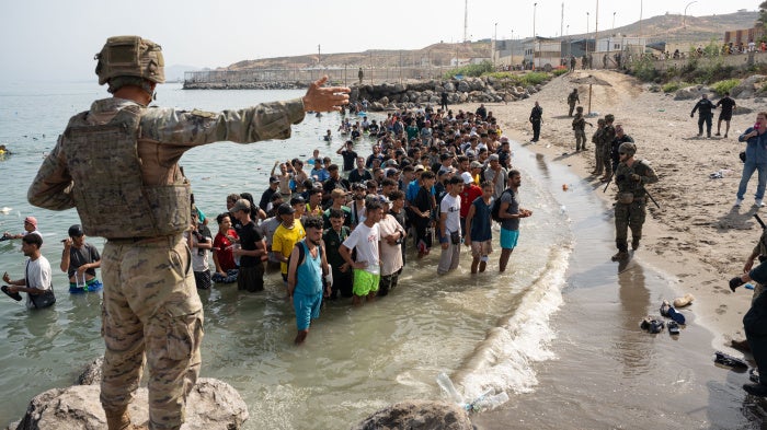 Migrants and asylum seekers gather near the border crossing between Morocco and Ceuta, a Spanish enclave, on July 31, 2026.