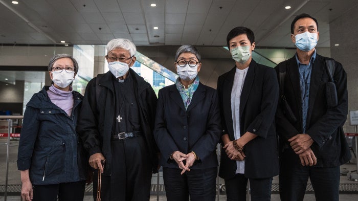 Former trustees of the 612 Humanitarian Relief Fund, following a verdict at the West Kowloon Magistrates' Courts in Hong Kong, November 25, 2022.