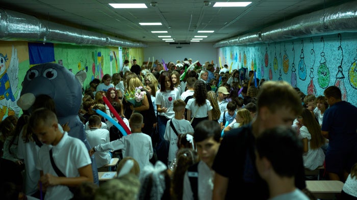 Children, parents, and teachers shelter underground during an air raid alert amid traditional back-to-school celebrations in Kyiv, Ukraine, September 1, 2026.