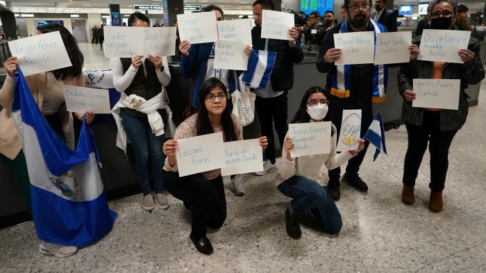 Activists hold signs with the names of some of the 222 former prisoners released and expelled by the Nicaraguan government, as they await their arrival at Dulles International Airport, Virginia, United States, February 9, 2023.