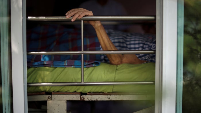 A person lies in bed at a nursing home in Ayutthaya, Thailand, April 9, 2016.