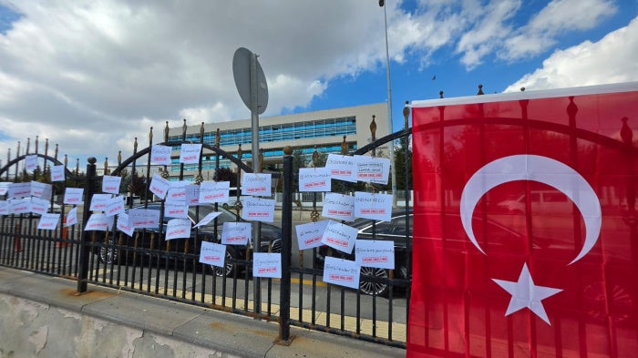 Tags, with “Access blocked” and the name of blocked accounts belonging to journalists and media outlets, LGBT and women’s rights groups, and other rights defenders, are tied to the gates of Turkey’s Constitutional Court, to protest the Turkish authorities’ blocking of hundreds of social media accounts and websites. Ankara, October 7, 2026.