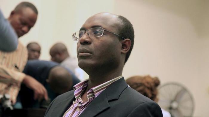 Journalist Rafael Marques de Morais sits in court in Luanda, Angola on May 28, 2015. 