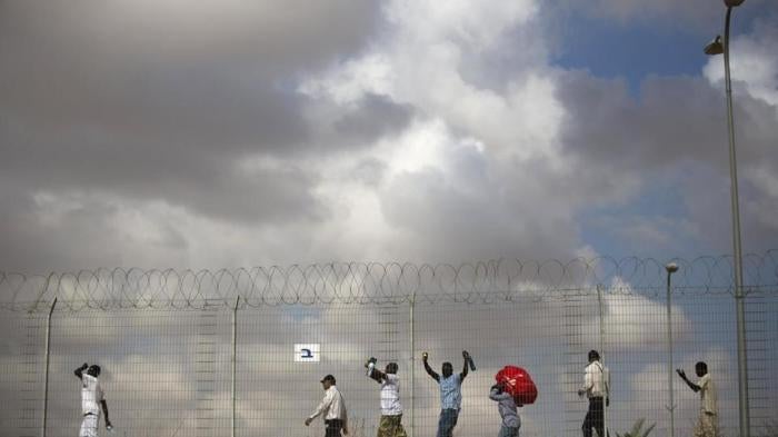Released Eritreans and Sudanese leaving the Holot detention center in Israel's southern Negev desert on August 25, 2015. 