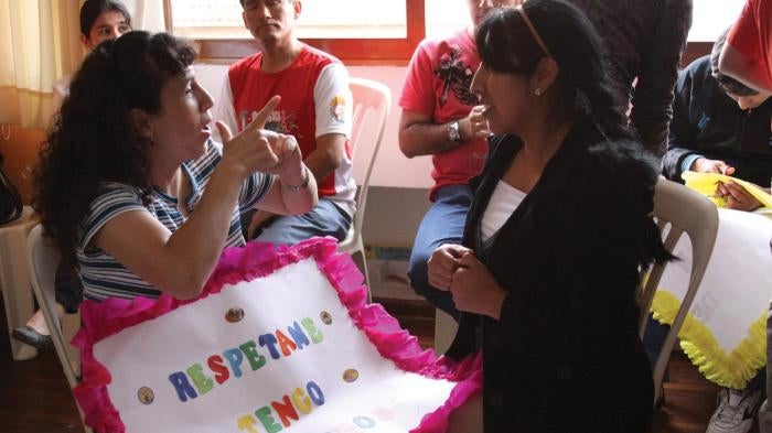 Using sign language, Monica, a deafblind woman, expresses her opinion on her right to political participation. She is a member of SENSE International Peru, an NGO working with deafblind people and their families.