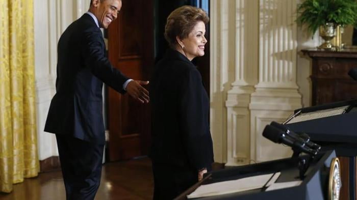 U.S. President Barack Obama and Brazil President Dilma Rousseff depart a joint news conference in the East Room of the White House in Washington, DC on June 30, 2015.
