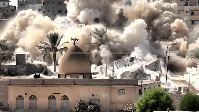 The Egyptian military destroys a building in Rafah, on the border with the Gaza Strip, during forced evictions between October 20-31, 2014. 