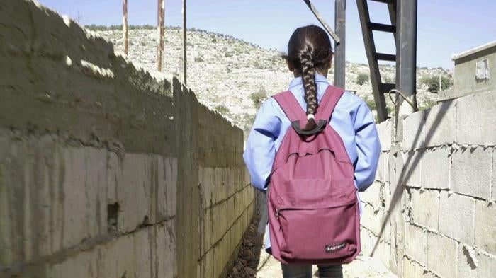Bara’a, 10, originally from Ghouta, Syria, leaves for school from her informal refugee camp in Mount Lebanon.