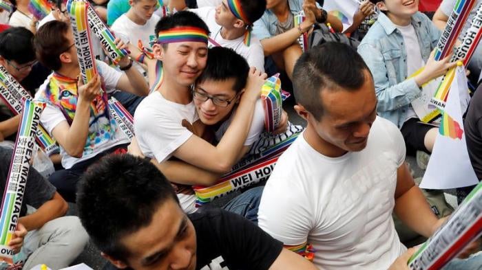 Supporters hug each other during a rally after Taiwan's constitutional court ruled that same-sex couples have the right to legally marry, the first such ruling in Asia, in Taipei, Taiwan May 24, 2017.