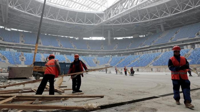 Construction workers on the St. Petersburg Stadium in St. Petersburg, Russia that will host 2017 FIFA Confederations Cup and 2018 FIFA World Cup matches. October 3, 2016. 