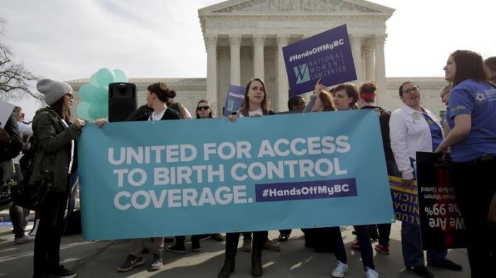 Supporters of contraception rally before Zubik v. Burwell, an appeal brought by Christian groups demanding full exemption from the requirement to provide insurance covering contraception under the Affordable Care Act, is heard by the U.S. Supreme Court in