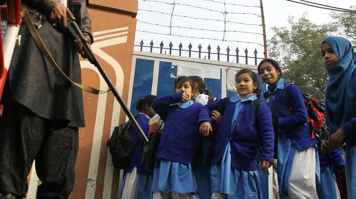Pakistani students in Lahore return to school under high alert security after the December 16, 2014 attack by the Pakistani Taliban on the Army Public School in Peshawar, January 1, 2015.