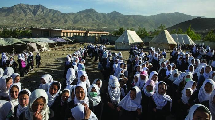 Girls gather to go home from school.