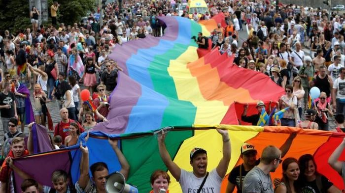 Participants hold a giant rainbow flag during the Prague Pride Parade where thousands marched through the city centre in support of gay rights, in Czech Republic, August 13, 2016. 