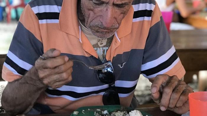 A 74-year-oldVenezuelan man eats lunch at a soup kitchen in Cúcuta, a Colombian city across the Venezuelan border, July 28, 2018.