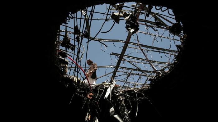The hole left by a Saudi-led coalition airstrike on a funeral hall in Sanaa, Yemen on October 8, 2016 that killed at least 100 people and wounded hundreds of others, October 10, 2016. 