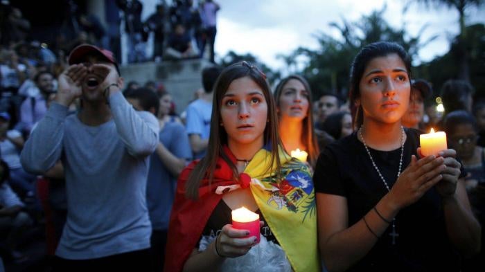Anti-government protestors in Venezuela take to the streets for a candlelight vigil in honor of protesters killed in clashes with security forces.