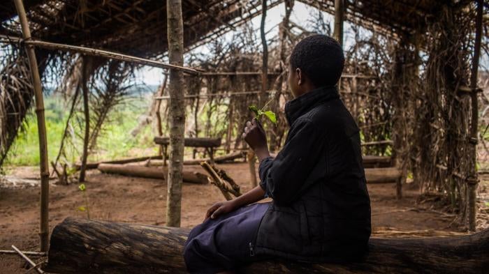 “Tshiela,” aged 10, sits in what was once her school in Mulombela village, Kasai region. The school was attacked by government forces in 2017 and five students were killed.