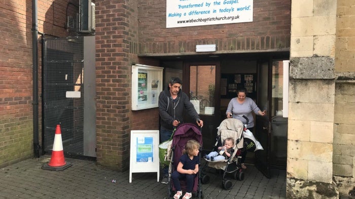 A couple and their two children leave the food bank in Wisbech, Cambridgeshire, after collecting a three day emergency supply of food, April 2019. They told Human Rights Watch the benefit cap left them unable to pay rent and afford food.