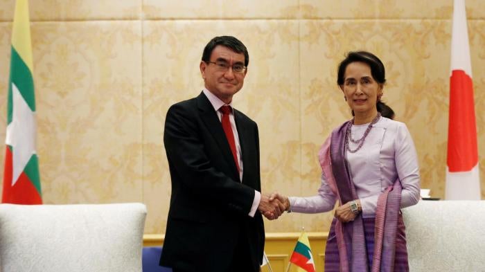Myanmar's State Counsellor Aung San Suu Kyi (R) meets Japan's Foreign Minister Taro Kono during the World Economic Forum on ASEAN in Hanoi, Vietnam September 12, 2018.