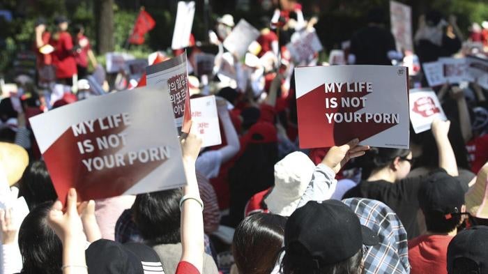 Women protest to demand stronger government action to fight the spread of intimate photos and footage taken by hidden cameras in Seoul, South Korea, July 7, 2018.