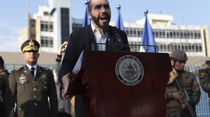 El Salvador's President Nayib Bukele, accompanied by members of the armed forces, speaks to his supporters outside Congress in San Salvador, El Salvador.