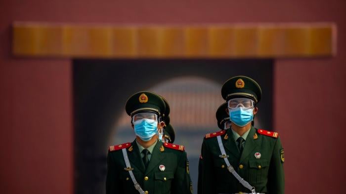 Chinese paramilitary police wear face masks in Beijing, May 1, 2020.