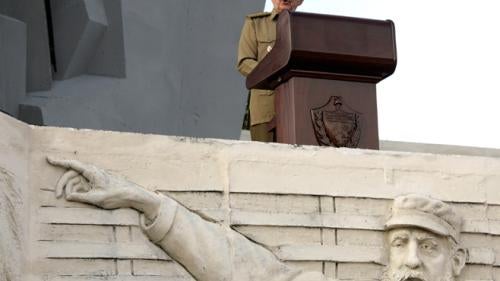 Raúl Castro speaks at a rally in Camagüey, Cuba, in July 2007, a year after being handed power by his ailing brother, Fidel Castro (depicted in the bas-relief in the foreground).