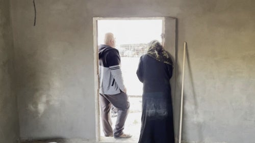 A room under construction by families displaced after attacks by settlers and soldiers from Khirbet Zanuta, in the southern West Bank, November 23, 2023.