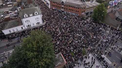 General view of people gathering to protest against a planned far-right anti-immigration protest in Walthamstow, London, Wednesday, Aug. 7, 2024.