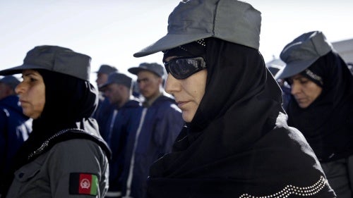 Afghan policewomen and policemen during their graduation ceremony