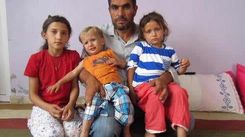 Mohammed, 42 and three of his relatives who were orphaned in the attack on June 25, 2015 in Kobani, Syria. 