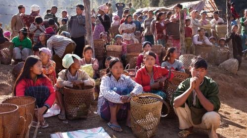 Displaced Kachin civilians living in temporary shelter in KIA-controlled territory in eastern Kachin State, wait for rations of rice and cooking oil, January 26, 2012. 