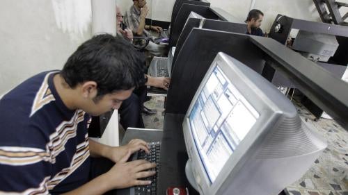An Iraqi man uses the internet at a cyber cafe in Baghdad on October 6, 2007.