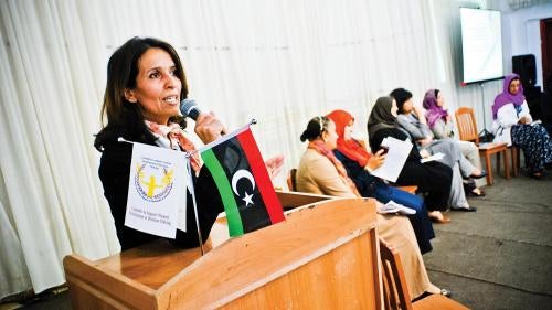 University professor and candidate Abir Imnina speaking at an event in Benghazi to support female candidates before the 2012 election. She proposed that elections in the transition years include quotas for women to ensure their participation in politics. 