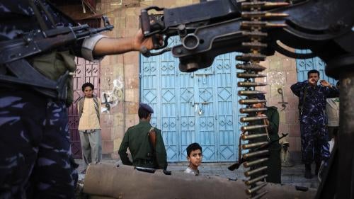 Police patrol al-Hasab neighborhood in the Yemeni city of Taizz on December 6, 2011.
