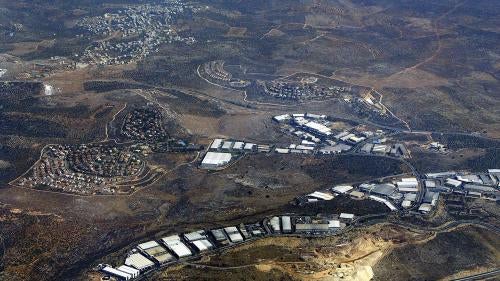 Barkan, located in the occupied West Bank, is an Israeli residential settlement and industrial zone that houses around 120 factories that export around 80 percent of their goods abroad. In the background is the Palestinian village of Khirbet Bani Hassan. 