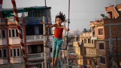 A girl plays in a public park in Patan, Nepal. Thirty-seven percent of girls in Nepal marry before age 18, and 10 percent are married by age 15. The minimum age of marriage under Nepali law is 20 years of age.
