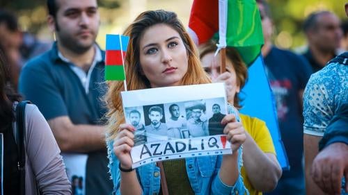 A protestor holds a sign calling for the release of unjustly imprisoned youth activists.  Baku, September 18, 2016. 