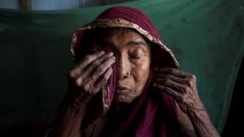 Anuwara Begum, in her 60s, cries while remembering her son-in-law, a farmer who died from arsenic-related illnesses. She herself has arsenic-related health conditions, but has never seen a doctor. Iruain village of Laksam Upazila in Comilla district, Bang