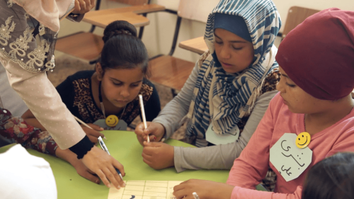 A photo of Syrian Refugee children studying in a class at the Nashama Al-Kheer Charity Association in Jordan.