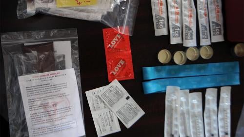 The “Stay Safe Kit,” distributed by the North Carolina Harm Reduction Coalition, includes clean needles, naloxone, condoms, and information on area resources for people who use drugs and other vulnerable populations in Wilmington, North Carolina. 