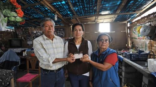 Antenor Hoyos Cubas and María Concepción Sagastegui Tapia, with their daughter, at their home in the outskirts of Lima, Peru, May 2017. Soldiers forcibly disappeared the couple’s son Nelson in June 1992.