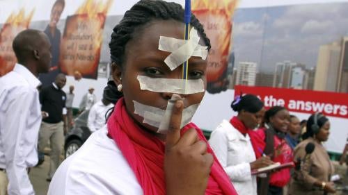 A Kenyan journalist participates in a protest in the capital, Nairobi, against draconian new laws restricting media freedom that were presented in parliament, December 3, 2013.