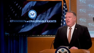 A monitor displays the words "Commission on Unalienable Rights" behind Secretary of State Mike Pompeo as he speaks during a news conference at the State Department in Washington, July 15, 2020.