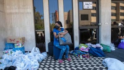 An Ethiopian domestic worker waits in front of the Ethiopian consulate after she and others were abandoned by their Lebanese employers, in Hazmieh, east of Beirut, Lebanon, June 4, 2020.